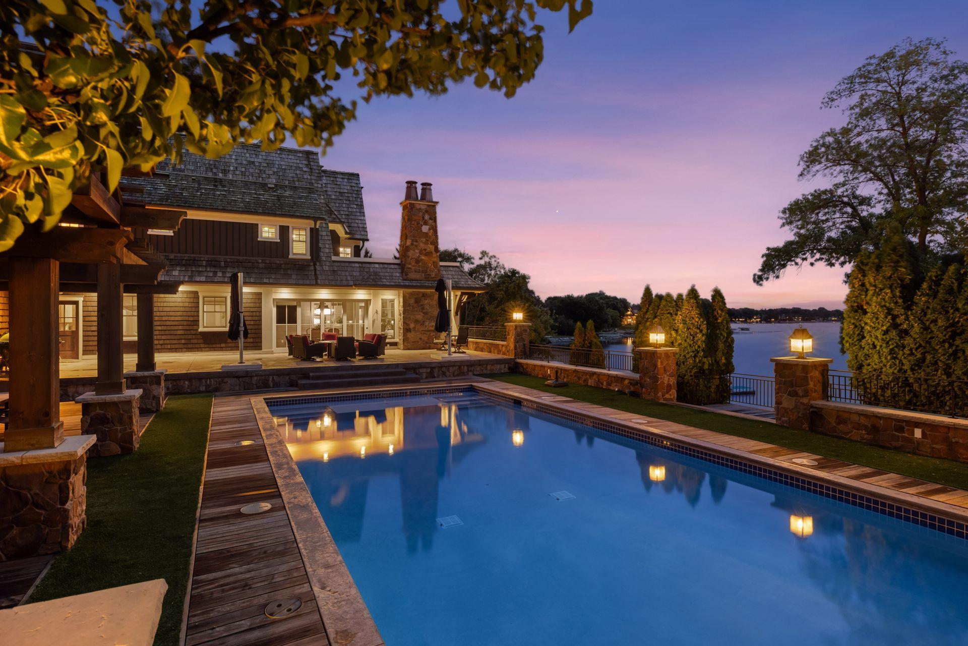 Heated outdoor pool and patio at dusk
