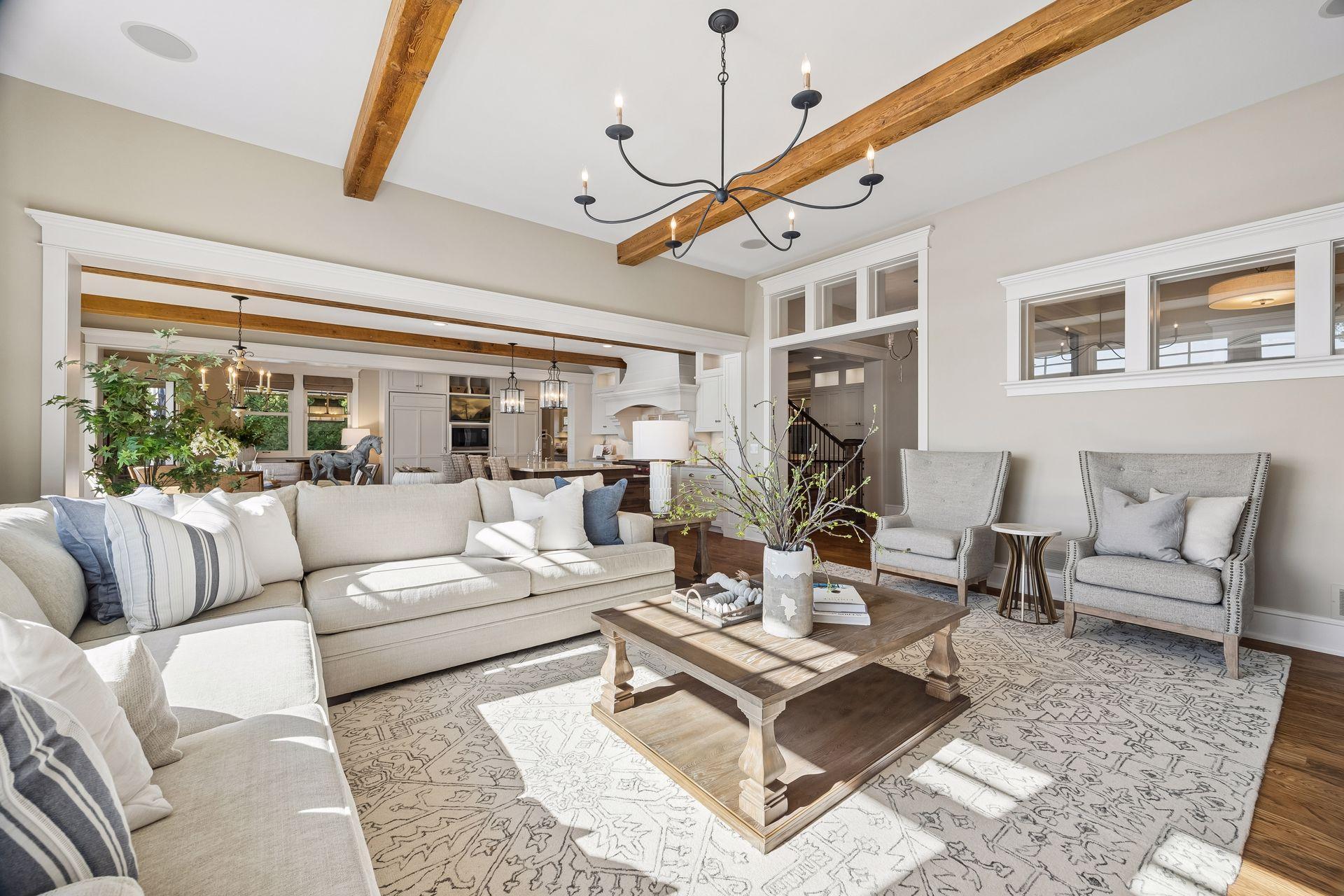 Living room with exposed beams and open-concept design