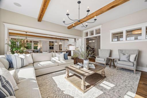 Living room with exposed beams and open-concept design