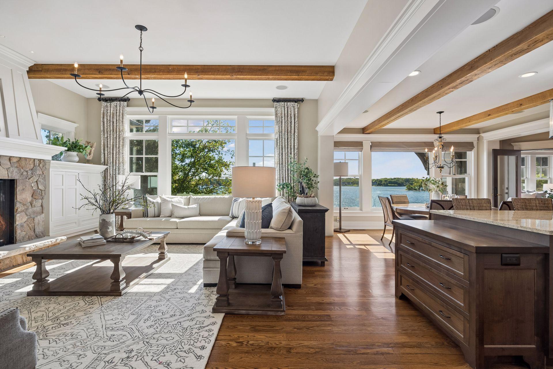 Open living spaces with exposed beams and lake views