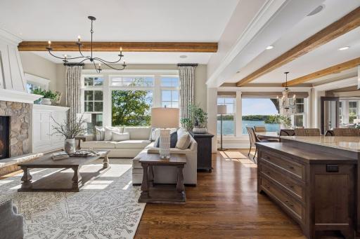 Open living spaces with exposed beams and lake views