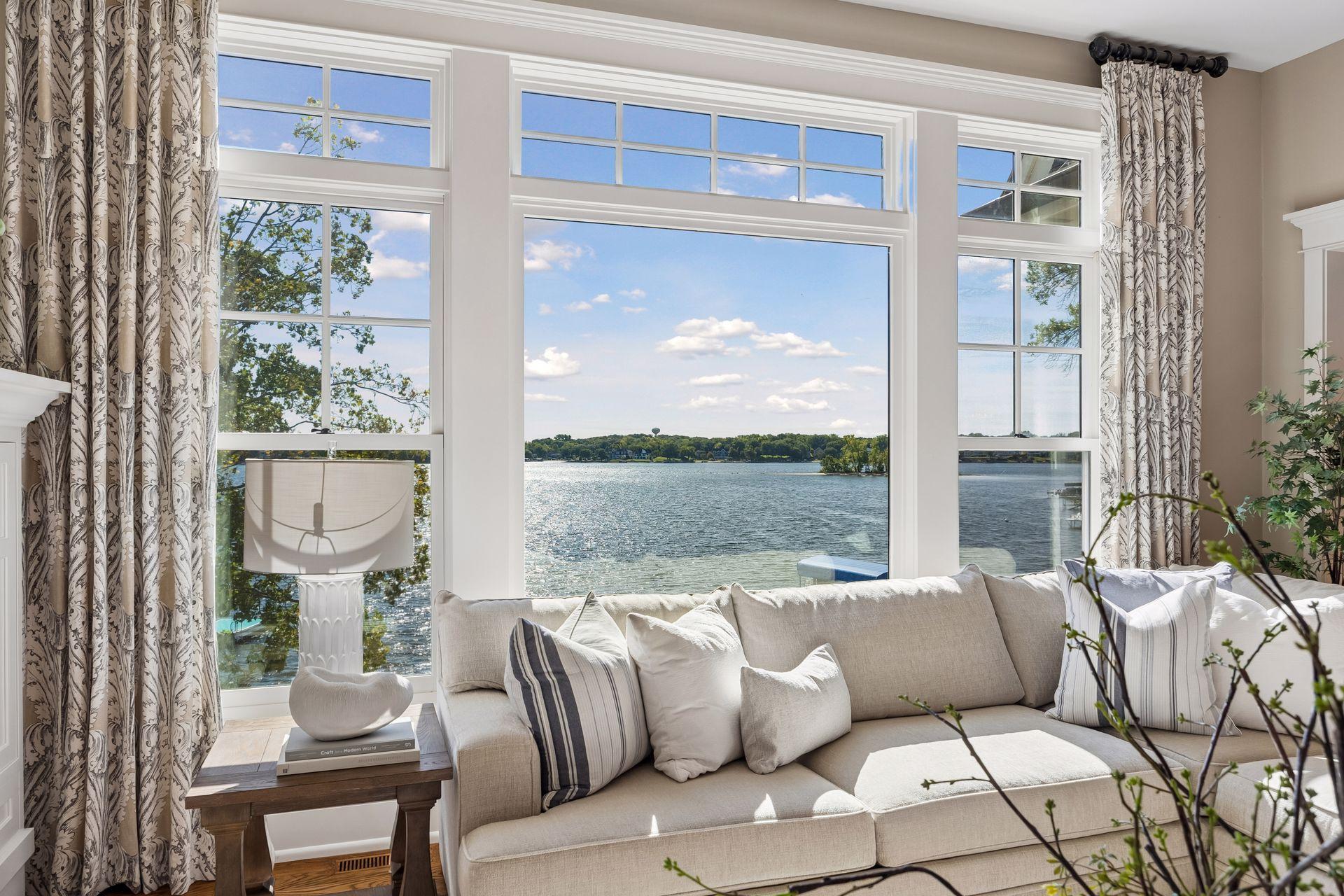 Wall of windows overlooking Prior Lake