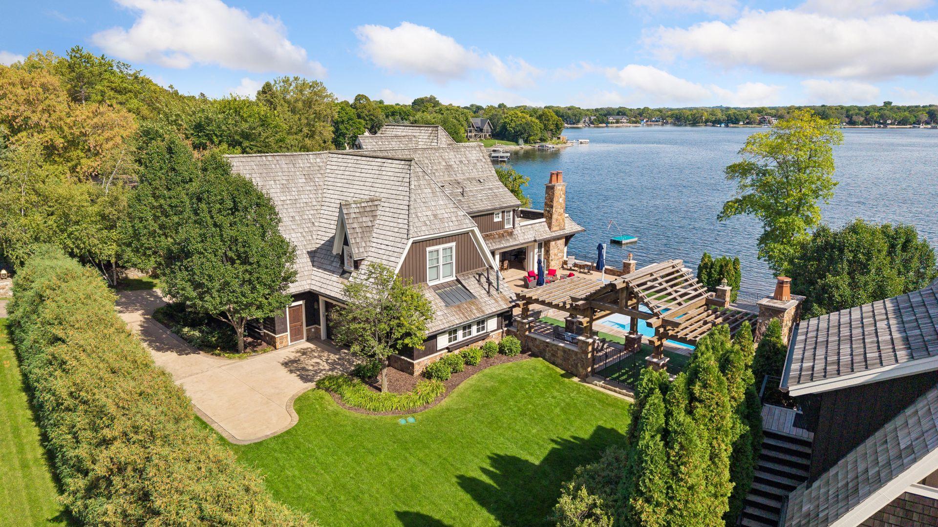 Aerial view showcasing outdoor living and lake views