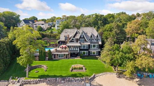 Rear exterior and expansive lakeside lawn