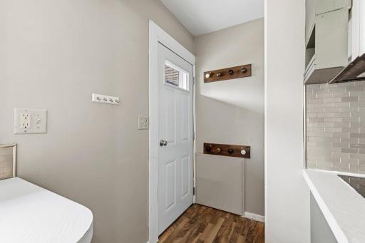 Back door features easy access from the detached garage