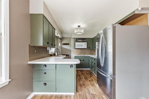 Walk-through kitchen with a wraparound island for extra counterspace