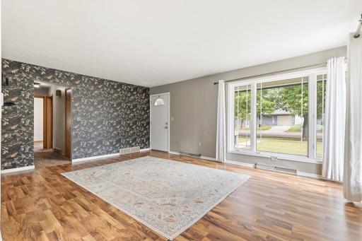 Step inside to an inviting, naturally lit front living room!