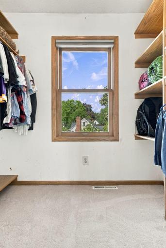 Primary bedroom walk in closet 1