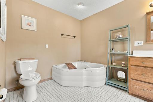 Upper floor bathroom w/ soaking tub and shower
