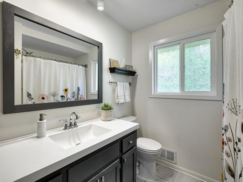 Your full bathroom provides a large vanity and nice storage.