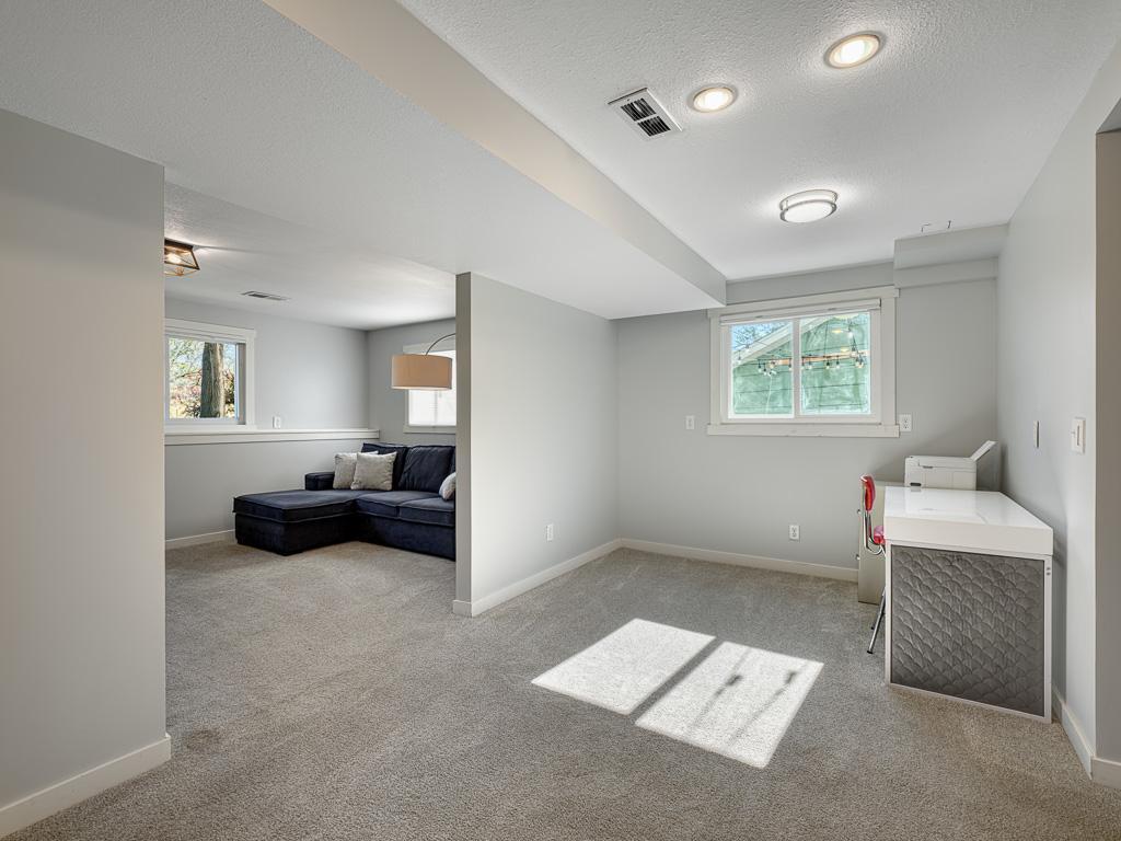 Your family room offers excellent light and creative flex space.