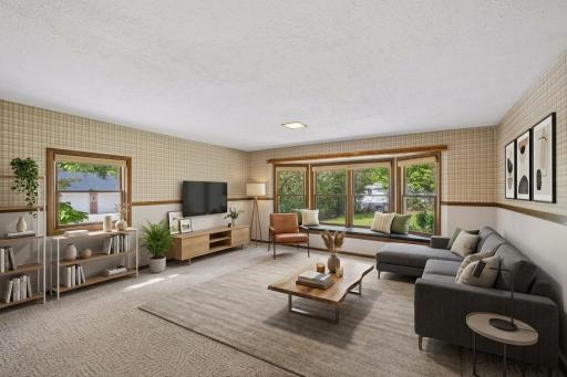 Main floor includes large family room with bay window off the back of the home - virtually staged