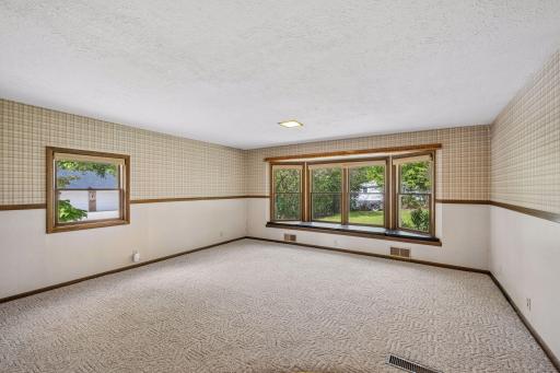 Main floor includes large family room with bay window off the back of the home