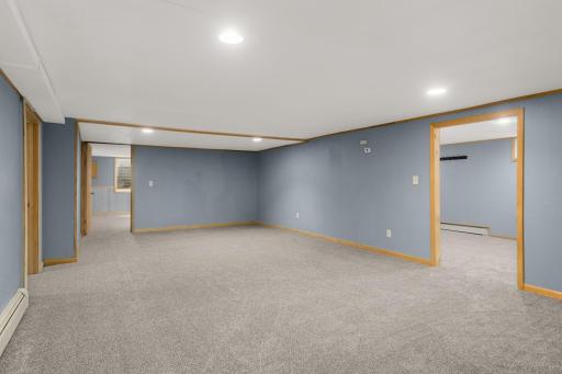 Brand-new carpet and recessed lighting freshen up the finished lower level.