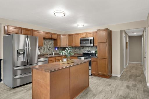 Center island adds extra prep space, storage and a convenient spot for casual seating.