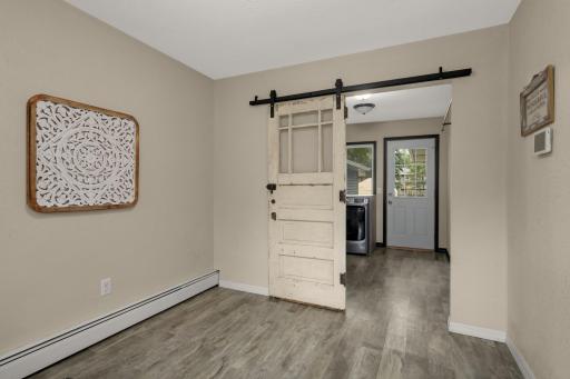 Barn door provides access to the conveniently located main-floor Laundry Room.