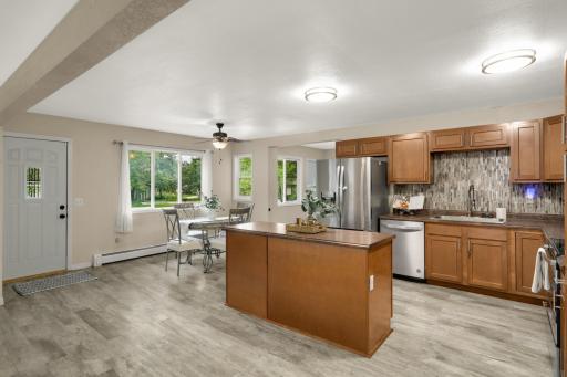 LVP flooring flows through the Kitchen and Dining Room for a cohesive look.