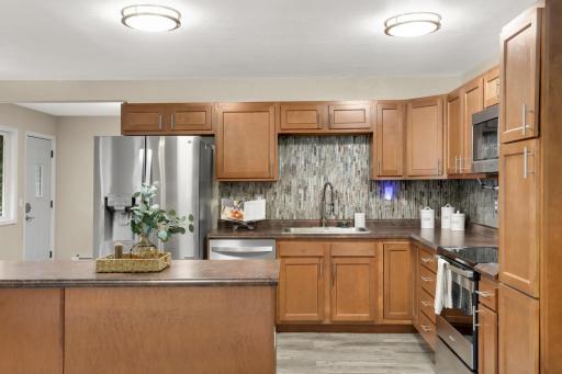 Plenty of cabinet and counter space makes this Kitchen functional for everyday cooking.
