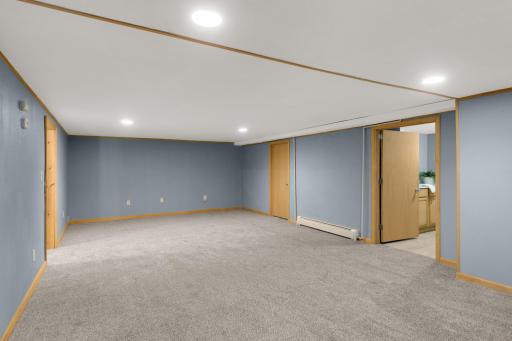 Large Family Room gives you another comfortable place to relax and unwind. New carpet and recessed lighting.