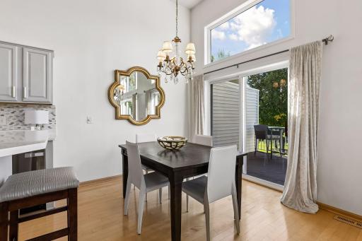 With a wall of windows and direct access to the deck, the dining room is perfectly positioned for everything from casual meals to entertaining.