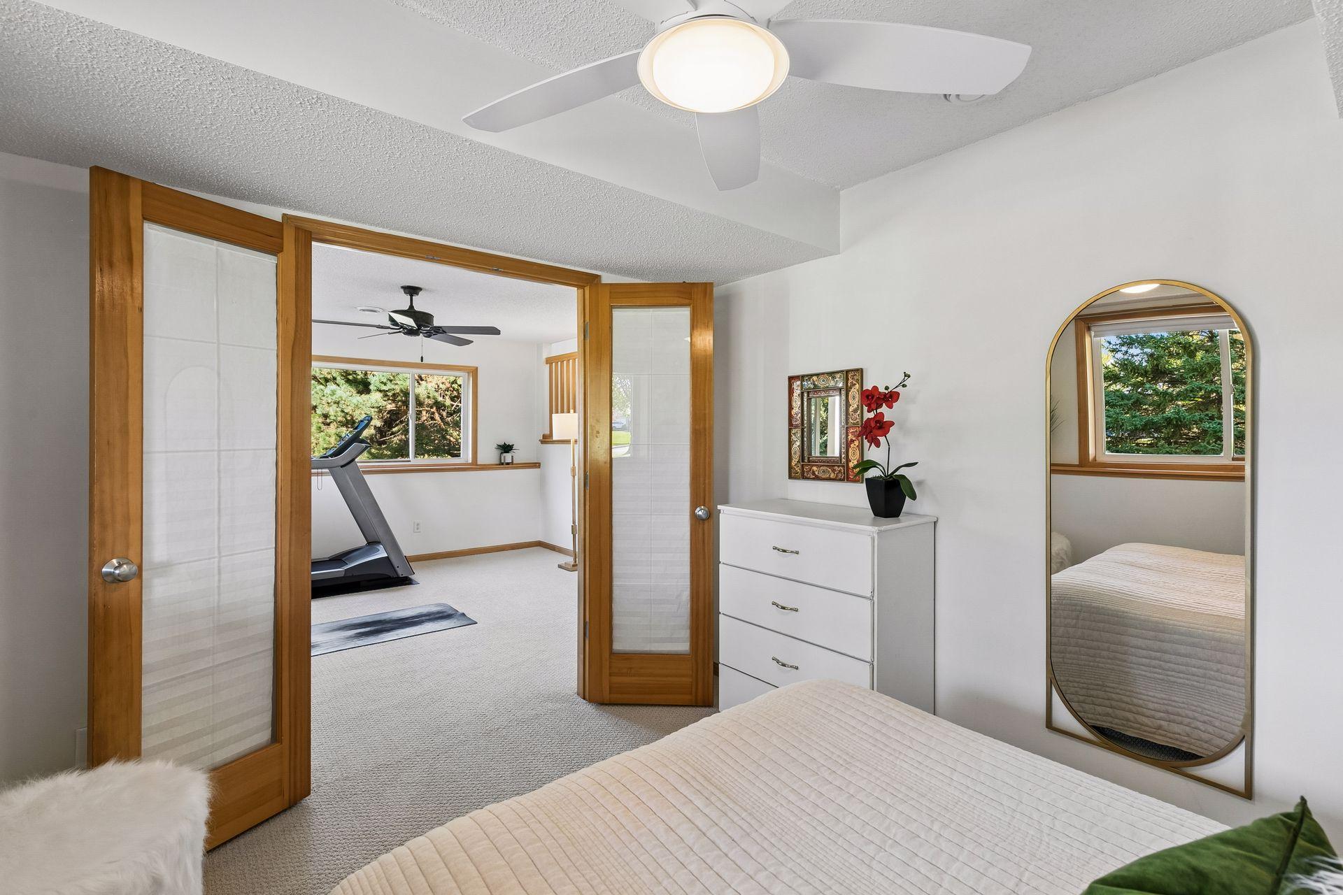 The French doors create an easy connection between the bedroom and family room while the lower level location provides privacy for guests or multi-generation living.