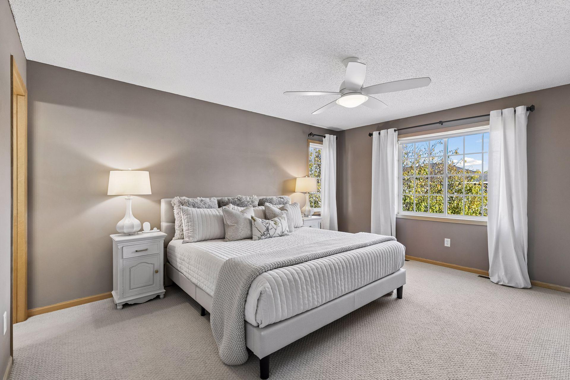 The generous primary bedroom gets wonderful natural light and offers plenty of room to create a comfortable retreat at the end of the day.