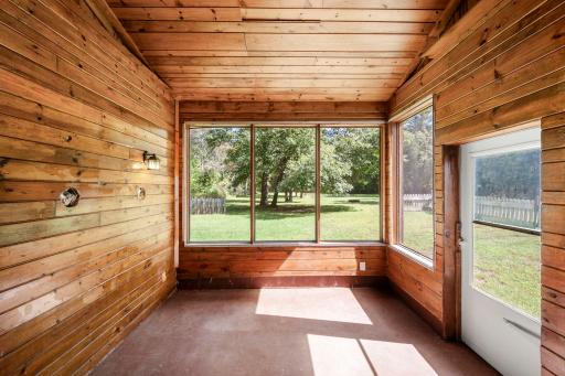 Three season porch with beautiful views of the backyard