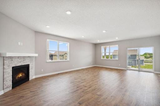 Open main level with laminate flooring throughout provides a great space for any type of gatherings. *Picture is of actual home.
