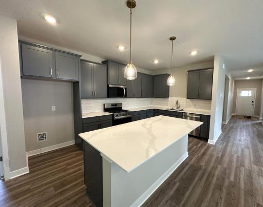 With accent gold pendants and pulls, this kitchen is a true showstopper. Picture is of actual home!