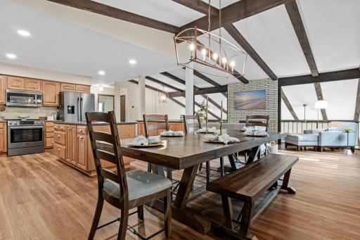Open floor plan with living room, dining room, and kitchen