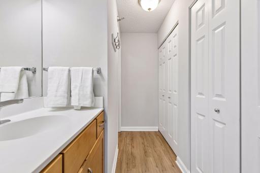 Primary ensuite bath and closet area.