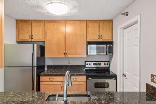 You won't miss a thing! Kitchen is open to the living room and dining area.