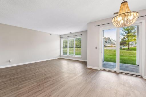 Living and dining rooms. A new sliding door to the patio, yard and sidewalks.