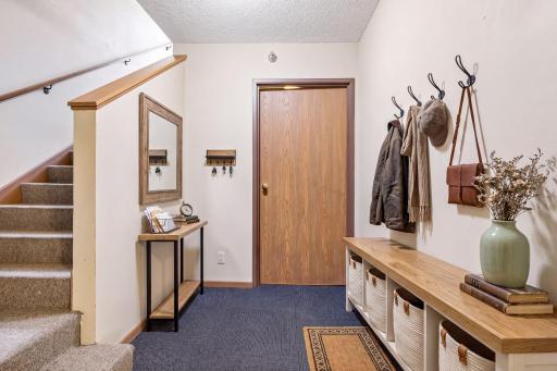 Virtually staged mudroom area.
