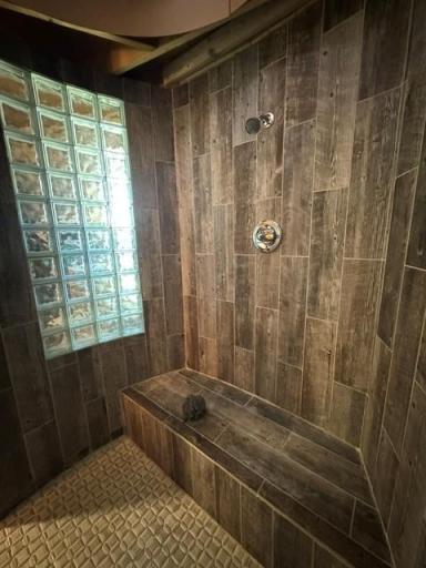 Tiled owners suite round shower ceiling, with light coming in from above is a must see.