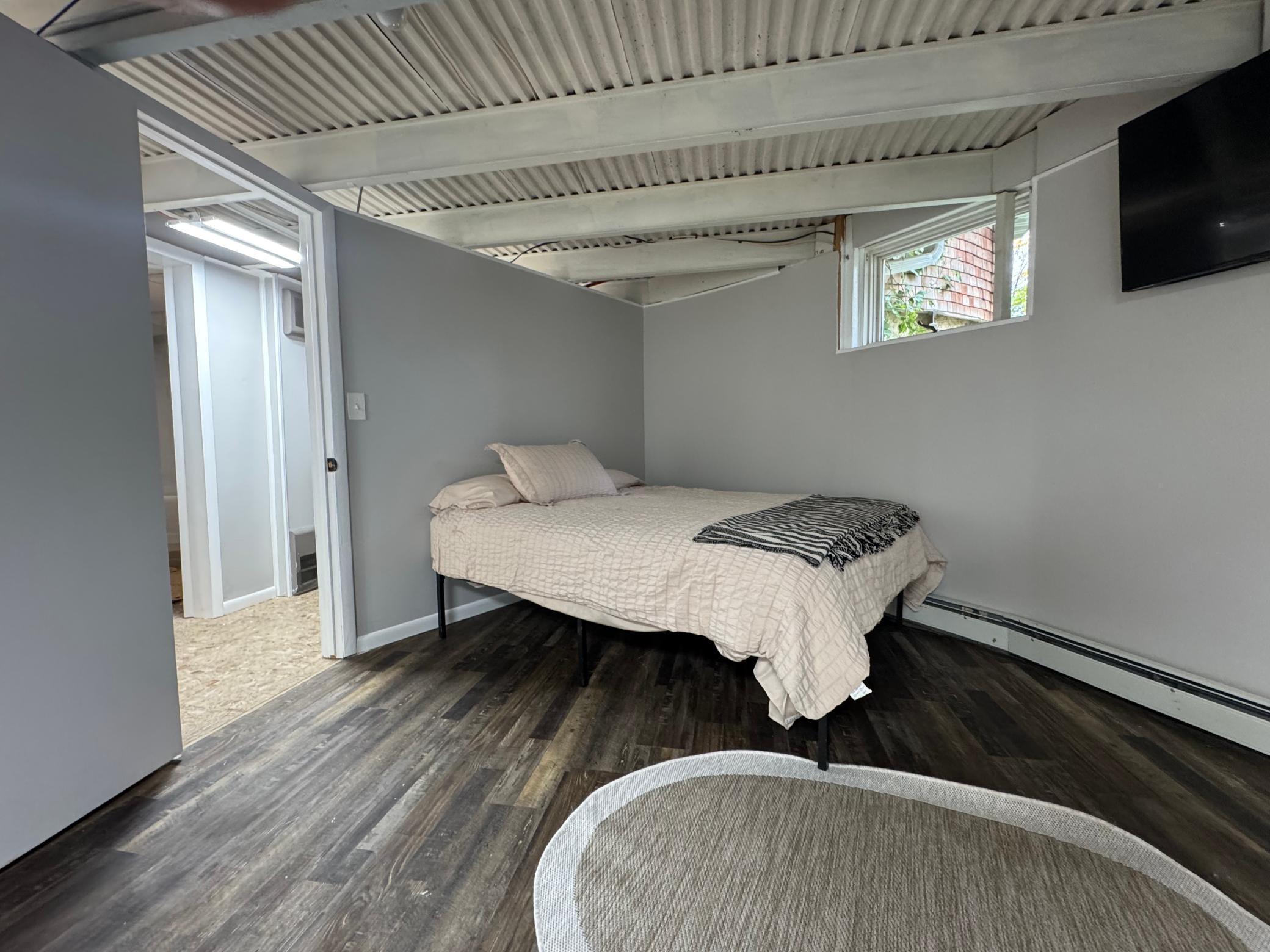 Lower level bedroom was two bedrooms but now made into one.