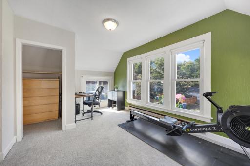 The second upper level bedroom has great windows and cozy carpet.