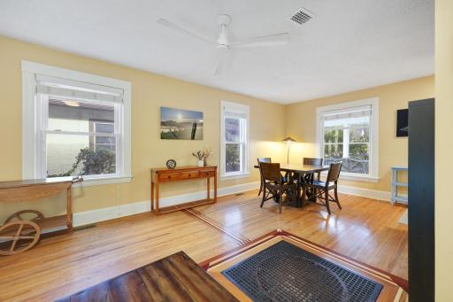 Beautiful wood floors flow throughout the main living spaces, adding warmth and character to the home.