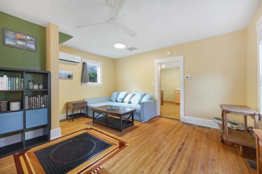 A bright and inviting living room offers plenty of space to settle in and make yourself at home.