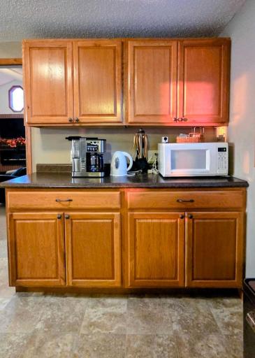Spacious kitchen with a large island table, perfect for entertaining and meals, complemented by beautiful lake views.