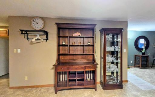 Open-concept layout seamlessly connects the dining area, living room, and kitchen, creating a spacious and inviting setting for everyday living and entertaining.