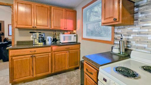 Spacious kitchen with a large island table, perfect for entertaining and meals, complemented by beautiful lake views.