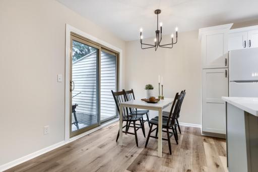 Bright dining area with sliding glass door access to the deck.