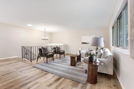 Bright living room with large windows and open layout.