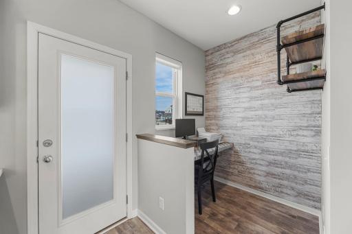 A built-in tiled desk nook with shelving provides the perfect work-from-home space.