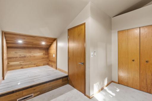 Upper level bedroom #3 with built-in platform for bed