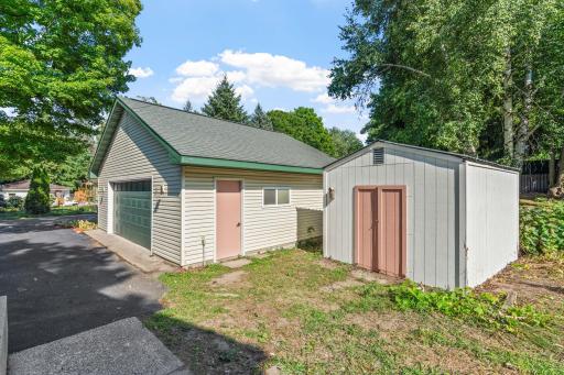 Oversized/newer garage + storage shed, dare I say, she-shed