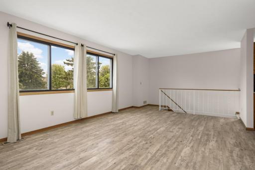 The entire home is freshly painted. The steps lead to the front entry door on ground level. The entry has a coat closet. The garage access door is also located in the entry space.