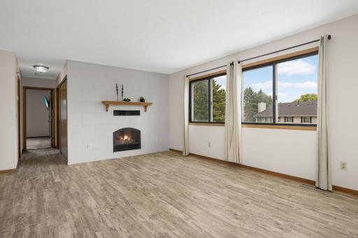 The wall of windows brings in natural light and a cheery inviting atmosphere. The bedrooms and bathroom are located down the hall.