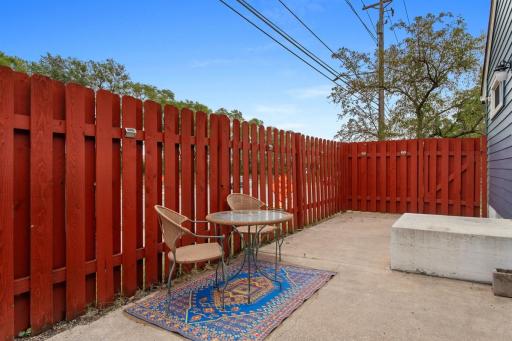 Private, fully fenced backyard on a spacious corner lot, offering plenty of room for kids and pets to play. Concrete patio and barbecue area create the perfect setting for summer gatherings and outdoor entertaining.